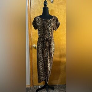 Leopard print faux wrap dress. NWT. Size small. Cuff sleeves. Tie belt.